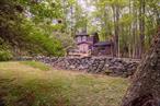 Charming Country Retreat on 2.5 Private AcresTucked away on a quiet country road and hidden from street view, this peaceful 2.5-acre retreat offers privacy, nature, and rustic charm. A long, tree-lined driveway accented by natural stone outcroppings leads you to a welcoming home full of warmth and character.Inside, you&rsquo;ll find 3 bedrooms and 1.5 baths, with one bedroom conveniently located on the main floor and two upstairs. The spacious living room is the heart of the home, featuring a wood-burning fireplace, vaulted ceiling, and generous windows that bring the outdoors in. The cozy kitchen is both charming and functional, flowing into a dedicated dining area.Multiple gathering spots throughout the property invite relaxation and connection with nature, including a serene three-season room, both front and rear decks, and a fire pit under the stars.Further up the driveway, a hidden surprise awaits: a vintage mobile shell with electric and plumbing connections already in place. Perfect for hobbyists, artists, or as storage for outdoor gear, this structure is a true blank canvas with endless potential.Whether you&rsquo;re looking for a tranquil weekend getaway or a quiet place to call home year-round, this property offers a perfect blend of privacy, natural beauty, and endless opportunity for personal enjoyment.