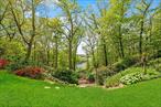 Hunter Brook Cove. Tucked away at the end of a meandering private drive, this extraordinary estate offers a rare blend of elegance, comfort, and awe-inspiring scenery. As you ascend past a serene pond, tennis court, and an inviting pool, the landscape begins to unfold. Two charming accessory buildingsâ€”a cottage and a seasonal pool houseâ€”set the tone for the relaxed, refined lifestyle this property offers.Arriving at the main residence, a breathtaking reveal still awaits. Step onto the front walk, and the view opens: an expansive, year-round panorama of a New York City reservoir, framed by exquisitely landscaped grounds that celebrate nature in all its richness and diversity.A lush canopy of mature native treesâ€”including red and white oaks, sugar maple, black cherry, sassafras, and stately shagbark hickoriesâ€”envelops the property. Graceful groupings of white pine add structure and softness, while gardens overflow with mature hydrangeas, azaleas, and rhododendrons in a display of color and texture that changes with the seasons.Whether you&rsquo;re enjoying a quiet morning in the orchard, a summer afternoon by the pool, or a sunset walk along the terraced paths, the estate offers endless opportunities to connect with the land.Inside the main residence, the great room impresses with soaring ceilings, a dramatic stone fireplace, and leaded glass windows that frame the spectacular reservoir view. Upstairs, a Juliet balcony offers yet another breathtaking vantage point over the water.Whether envisioned as a full-time residence or a luxurious weekend escape, Hunter Brook Cove delivers timeless beauty and unparalleled seclusionâ€”just a short drive or train ride from New York City.