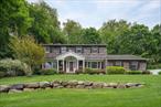 Tucked away on a serene, tree-lined acre, this beautifully updated traditional center hall Colonial offers the perfect balance of timeless charm and modern comfort. From the moment you arrive, you&rsquo;ll be drawn in by the home&rsquo;s peaceful setting, abundant natural light, and inviting layout. Inside, discover a thoughtfully designed floor plan featuring a recently renovated kitchen and updated bathrooms, seamlessly blending style and functionality. The main level offers a spacious living room with fireplace, formal dining room, cozy family room, and a sun-filled eat-in kitchenâ€”ideal for everyday living or entertaining with ease. Step outside to your own backyard retreat. The outdoor brick patio with pergola is perfect for hosting gatherings, dining al fresco, or simply enjoying the quiet and privacy of the lush, 1-acre property. Mature trees surround the home, offering beauty, shade, and a true sense of escape. Upstairs, the primary suite provides a private sanctuary, while three additional bedrooms and updated bathrooms offer comfort and flexibility for family and guests. The partially finished basement and full attic provide ample space for storage, hobbies, or future expansion. Additional features include central air, 2 fireplaces, 2-car garage, and a convenient location close to schools, parks, shopping, and all the best of Huntington. Located in the South Huntington School District, with easy access to Henry L. Stimson Middle School and Walt Whitman High School.
