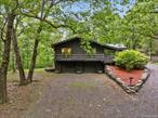 Welcome to your private retreat in the Taconic Hills School District!Set on 8 serene acres, this beautifully renovated home offers the perfect balance of comfort, style, and versatility. With 5 bedrooms and 4 full baths, thereâ€™s plenty of space for family, friends, or guests. The sun-drenched great room is the heart of the home, featuring vaulted ceilings and dual stone fireplaces that create a warm, inviting atmosphere. The updated kitchen is both functional and stylish, complete with new cabinetry, butcher block countertops, and a spacious walk-in pantry. The finished lower level offers 2 additional bedrooms, a full bath, a family room, and a walkout, making it an ideal setup for guests, in-laws, or even rental potential. An oversized 2-car garage provides ample storage, while the open, peaceful grounds invite you to enjoy nature and outdoor living. Perfectly locatedâ€”just 20 minutes to Catamount Ski Resort, Hudson, and Lake Taghkanic, and only an hour to Hunter and Windhamâ€”this property is ideal as a primary residence, weekend escape, or a high-potential short-term rental. Donâ€™t miss the chance to make this versatile and beautifully updated property yours!