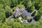 When Only The Best Will Do!!  A Hudson Valley Masterpiece perfectly placed at the end of a cul-de-sac. Bring the whole family to this 5043 square foot multi-generational home that offers a blend of privacy with the luxury of nearby commuter accessibility. The journey begins on a private road of executive homes through a natural canopy of mature trees leading to the stunning private estate that includes a 2-bedroom accessory apartment. The circular driveway brings you to 5.8 acres of professionally landscaped beauty including a private pond. The main floor starts with inlaid hardwood floors leading to a formal dining room, a library, a first floor bedroom and first floor full bath and then into the great room with it&rsquo;s floor to ceiling windows designed to enjoy the beauty of the four seasons from the comfort of inside. The custom designed kitchen is the soul of the home with it&rsquo;s toffee glazed cabinets, granite counters, massive island, two dishwashers, two full size wall ovens, three sinks, a built in work space and a breakfast nook. Then onto the heart of the home... a stunning stone and tile sunroom overlooking the back yard and pond. Upstairs is host to two guest bedrooms, an office with double door closets, a loft area, a laundry room, a full guest bathroom, a primary suite with an enormous walk in closet, additional closet space, a bonus home gym and the primary bathroom with radiant heat. Next is the two bedroom, one bath accessory apartment with it&rsquo;s own entrance and parking area.  Ideal for extended family or guests, this apartment has a living room with gas fireplace, a screened in porch, a dining area, kitchen with granite counters and it&rsquo;s own laundry, two ample sized bedrooms and a fully bath with a walk in shower. Additional finer points of this home include OWNED solar panels, whole house generator, heated three car garage, indoor fire suppression system, tremendous brick patio, central vacuum, brand new paved driveway, a pull down stair attic with floorboards, an unfinished basement for storage, 6 zone heat and three zone central air, surround sound, two built in safes and so much more. Did I mention that this home is located in the highly sought after Cornwall School District? Located just 5 minutes from Stewart International Airport and a short drive to 9W, I84, I87, West Point, and Stewart National Guard Base. Enjoy hiking, local farmer markets, ice cream stands, parks, near by shopping at Woodbury Common and five star river dining. Call today for a private tour.