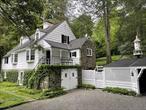 This beautiful Chappaqua house sits on 3.25 acres surrounded by formal gardens and woods. Designed by the renowned Westchester architect James Renwick Thomson in the 30&rsquo;s, this home seamlessly incorporates both elements of formal sophistication along with more casual charm. It is a one-of-a-kind gem, containing Palladian windows, vaulted ceiling, custom wood work, bay windows, Dutch doors, roughhewn beams and a second-floor terrace for dining al fresco. The grounds include formal gardens with multiple sitting areas, two koi ponds, and pebbled pathways. The red clay tennis court, stream, and long driveway add to the property&rsquo;s unique qualities. Join one of the many swim and tennis clubs minutes away. All this in the award-winning Chappaqua School District. Convenient to NYC by either car or train.