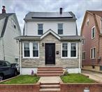 Enjoy this spacious Legal 2 Family home in the heart of beautiful St. Albans Queens. The open floor plan creates a warm greeting as you enter into the home. Family will always have a connection after a busy day sharing meals and experiences around the lovely Island. The master bedroom is located at the entry level floor, featuring a stunning fully upgraded En Suite Bathroom. The amazing original hardwood flooring throughout truly set the tone! This home features a special corner that offers space as either a buffet or coffee corner to be appreciated. Natural lighting comes naturally throughout this beautiful home with all of the Newly installed double pane windows and recess lighting features. All of the bathrooms have been fully upgraded in addition to a completely open concept in the basement. The family presently utilizes the space as a single all 5 bedrooms 3 baths. Presently there are two separate electrical meters for the individual floors. One meter is billed for the usage of the 1st floor & basement; the 2nd floor is billed separately. solar panels exist and may be transferred. Private 3 Car Driveway Parking, Backyard and a stunning new entry door. Within walking distance to all public transportation, financial institutions, various houses of worship and a community filled with wonderful neighbors.