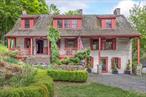 c. 1775. Step into a world where historic charm meets timeless elegance. Known as The Old Toll House, this meticulously restored stone residence is a rare fusion of 18th-century charm and modern comfort. At the heart of the home lies a grand and inviting kitchen, where a massive stone hearth- framed with imported Belgian tiles- serves as the room&rsquo;s dramatic focal point. Hand-hewn beams lend warmth and architectural authenticity, while an adjacent grotto with copper-topped counters and generous storage provides space for culinary creativity and organization. The formal dining room features an original fireplace, built-in cabinetry, and distinctive fabric-clad walls, creating a dramatic and memorable setting for entertaining. The living room showcases intricate wood details, while Brazilian wide-board pine flooring flows throughout. A mahogany-accented bathroom completes the main level with a refined touch of artistry and sophistication. Upstairs, three versatile bedrooms offer flexible living options, including a dedicated libraryâ€”ideal as a home office, reading retreat, or creative sanctuary. A second full bath, with custom tilework, adds convenience while honoring the home&rsquo;s character. Set on 1.4 acres, the grounds are framed by expansive gardens, mature trees, and rock walls. Ideally located just five minutes from New Paltz, and ten minutes from Kingston&rsquo;s vibrant Rondout District, offering easy access to local markets, fine dining and outdoor recreation. This is a home for those who appreciate craftsmanship, history and enduring beautyâ€”an exceptional opportunity to own a piece of Hudson Valley heritage, perfectly preserved for modern-day living.