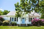 This beautifully preserved 1930s Cape-style home on just under an acre boasts classic character, modern updates and coveted access to Orange Lake, Newburghâ€™s 400 acre private lake. Inside, timeless architectural details aboundâ€”original period details include graceful arched doorways, rich hardwood flooring and a commanding stone fireplace. The main level offers a sunlit bedroom and full bathroomâ€”perfect for guests or one-level livingâ€”as well as a versatile bonus room off the dining room, ideal for a home office or flexible storage needs. Upstairs, two sun-filled bedrooms share easy access to a second full bathroom. Step out of the spacious updated kitchen and into a private backyard sanctuary, dotted with old growth flowering trees and mature landscaping. The expansive patio overlooks a heated in-ground saltwater pool and spaâ€”a perfect backdrop for summer entertaining or quiet relaxation. Additional highlights include central air conditioning, a detached two-car garage and substantial 470+ square foot bonus space in the refinished basement, complete with laundry room and half bath. Tucked away on a quiet street yet easily accessible, this charming home is minutes away from schools, local parks and Newburghâ€™s vibrant riverfront district. Commuters will appreciate the home&rsquo;s prime access to major highways, Stewart International Airport, and the Beacon train station.