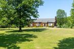 On a country road overlooking a beautiful spring-fed pond sits a 3, 228 sq ft cedar-sided traditional home. Set on 23 stunning acres of open fields, mature trees, and bucolic landscaping, just outside from the Village of Millbrook. Inside, the home features a spacious and flexible layout with 4 bedrooms, 3 full baths, central A/C, and a gas fireplace. The upper level welcomes you into an open living room and dining area with access to a large deck, perfect for entertaining. The kitchen is well-situated, while two guest bedrooms share a full bath. The primary ensuite opens into a sunroom overlooking the pond, ideal for morning coffee, reading, or meditation.The finished lower level includes a generous family room, screened porch, and an attached 2-car garage. Step outside to explore private walking trails and a tranquil meditation tea house tucked in the trees. Located on a one-lane gravel road maintained by the town and accessed via a historic scenic route, this property is just 2 hours from NYC by car or train, offering both seclusion and accessibility. Explore the opportunity to purchase additional adjacent acreage.