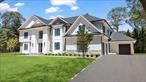Welcome to 11 Ingold - Experience the pinnacle of refined living in this nearly 6, 000 sq ft custom-built estate by acclaimed Piazza Custom Builders, set on a quiet, tree-lined street within the Half Hollow Hills School District. A harmonious blend of architectural elegance, timeless craftsmanship, and cutting-edge design, this six-bedroom, five-and-a-half-bath masterpiece offers a lifestyle of comfort, sophistication, and seamless functionality.A dramatic 22-foot front-to-back entry foyer welcomes you into an expansive open-concept floor plan flooded with natural light. The main level impresses with soaring 10-foot ceilings, exquisite tray ceilings in the formal dining room, great room, and den, and a stunning floor-to-ceiling porcelain stone fireplace that anchors the living space. At the heart of the home lies a chefâ€™s dream kitchenâ€”an artful blend of form and function featuring custom white oak cabinetry, an oversized quartzite island, and state-of-the-art Thermador appliances.Thoughtfully designed for multi-generational living, the first-floor guest suite includes a private entranceâ€”ideal for extended family, in-laws, or au pair accommodations. A spacious mudroom with custom built-ins and a three-car garage elevate everyday convenience with understated elegance.Upstairs, retreat to the luxurious primary suiteâ€”a serene sanctuary with a spa-inspired ensuite bathroom complete with radiant heated floors, dual vanities, a walk-in shower, soaking tub and premium fixtures. Two additional ensuite bedrooms, a Jack-and-Jill suite, and a second-floor laundry room complete the upper level with both privacy and practicality.The full walk-out basement offers an additional 3, 000 sq ft with 10-foot ceilingsâ€”perfect for future customization as a home theater, gym, or wine cellar. A full-height attic provides extensive storage and room to grow.Crafted with sustainability and smart living in mind, the home features Marvin windows, spray foam insulation, Hardie board and stone exterior finishes, and integrated smart home technology. Outside, professionally landscaped grounds framed by mature Green Giant Arborvitae create a lush, private backyard retreat.Perfectly located just minutes from schools, major highways, shopping, and dining, this soon-to-be-completed home offers a rare opportunity to own a modern luxury home in one of Long Islandâ€™s most sought-after communities.