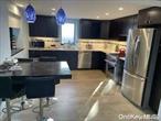 Location a block from the beach. Modern studio apartment with porcelain tiled radiant heated floors. Built in Queen Murphy bed, chef&rsquo;s kitchen with Quartz counters. Great for entertaining. French door frame. A beautiful garden as well.