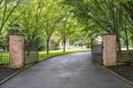 Behind a discreet gated entrance serving just two residences, this distinguished custom-built brick Colonial offers a rare blend of privacy in the Village of North Hills. Offering over 5, 000 square feet of refined living space, including a beautifully finished legal lower level, this residence is thoughtfully designed for everyday comfort, functionality, and elegant entertaining. A grand two-story foyer welcomes you into the homeâ€™s elegant interior, where over 9.5 foot ceilings, hardwood flooring, and custom crown and base moldings set the tone for quality craftsmanship throughout. Oversized Marvin double-pane windows and patio doors frame views of the lush surroundings, bringing a sense of nature indoors and filling each room with magnificent natural light. Gather in the expansive living room by the warmth of the gas fireplace, or host memorable occasions in the formal dining room and chefâ€™s kitchen outfitted with Sub-Zero and Viking appliances. A separate butlerâ€™s pantry and beverage station add ease to entertaining, while the homeâ€™s open-concept flow allows each space to feel connected yet distinct. The second level primary suite offers a serene retreat, with ample closet space and a spa-like ensuite bath featuring a jetted soaking tub, glass-enclosed shower, and two separate vanities. There are three additional bedrooms, including two that share access to a private terrace area.Finished lower level offers tremendous versatility with an expansive recreation area, oversized windows that provide excellent natural light, a large-scale bedroom, full laundry area, mechanical room, and convenient access to the two-car garage. Whether used as a guest suite, home office, fitness studio, or media lounge, this level offers flexible space to suit a variety of lifestyles. This meticulously maintained home offers unparalleled privacy while being just moments from town, the Manhasset LIRR station, major highways, world-renowned shopping, and top-tier Long Island restaurants and cafes. A truly private residence with all the conveniences of its prime North Shore setting.