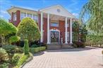 Experience unparalleled luxury in this breathtaking Malba mansion, positioned ideally across from a pristine sandy beach and offering commanding, unobstructed views of the iconic Whitestone Bridge. A grand circular driveway welcomes you to this stately Whitestone residence, setting the tone for the elegance that lies within. Step into a soaring double height foyer that leads to an elegant formal living room, complete with a classic fireplace. The dining room provides an ideal setting for sophisticated entertaining, while the expansive gourmet kitchen is a chef&rsquo;s dream - featuring rich cherry cabinetry, gleaming granite countertops and top of the line appliances. The den leads out to the backyard with its private pool and garden. All the windows throughout have been customized with serene plantation shutters. Upstairs, you will find a grand landing with a panoramic window, and 4 generously appointed bedrooms plus two luxurious full baths. The fully finished lower level includes a summer kitchen, walk in closet, the laundry room, an office and full bathroom, offering versatile space for extended guests or casual gatherings.Outdoors, indulge in resort-style living with a private, heated saltwater pool surrounded by elegant pavers and a custom gazebo, making the yard perfect for relaxing and entertaining. The property also features an attached one car garage and an additional detached garage fitting 2 cars. A rare opportunity to own a refined coastal retreat in one of Queens&rsquo; most prestigious enclaves.