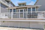 Welcome to this beautifully updated beachside bungalow ideally located on a wide, sought-after block in Long Beach&rsquo;s desirable West End...just steps from the sand. Fully renovated in 2016, this charming home offers modern comfort and efficiency with all-new windows, roof, siding, insulation and dry wall.Inside, a spacious open floor plan features gleaming hardwood floors throughout and a cozy wood-burning fireplace that adds warmth and character. The all new kitchen showcases rich wood cabinetry, granite countertops, stainless steel appliances stylish fixtures. An island seats up to four and a nearby dining nook create an ideal space for casual dining or entertaining. The home includes three inviting bedrooms and a spa-inspired bathroom with porcelain tile and a spacious walk-in shower. A full, unfinished basement with high ceilings and a dedicated laundry area provides excellent storage.Whether you&rsquo;re seeking a full-time residence or the perfect beachside escape, this West End gem offers the best of coastal living.