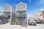 Beautiful raised home in the heart of Arverne awaits. This newly renovated single family home is located on a quiet block close to Jamaica Bay. Some features include hardwood floors, stainless steel appliances and energy efficient split units for heating and cooling. The 30 x 100 lot has a private backyard, private driveway and garage. Just minutes from the sandy shores of Rockaway Beach, shops restaurants, public transportation and only 20 minutes to JFK International airport.