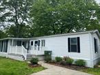 Discover comfort and convenience in this beautifully renovated 2-bedroom, 2-bath mobile home. Featuring a bright, open layout, this home offers a spacious sunroom perfect for relaxing year-round and a charming deck ideal for outdoor gatherings. The updated kitchen and baths add a modern touch, while the primary suite provides a private retreat with its own full bath.A detached storage shed offers extra space for tools, bikes, or seasonal items. Located just minutes from top-rated schools, shopping centers, parks, and local farms, this home is perfectly situated for easy living. Whether you&rsquo;re downsizing, starting out, or seeking an affordable lifestyle, this home is a smart and stylish choice.Donâ€™t miss your chance to own this move-in-ready gem in a great location! Cameras on site.