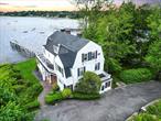 A Rare opportunity to own a waterfront compound on Long Islandâ€™s Gold Coast within the prestigious Village of Kings Point , New York. This gated and fenced 1.02-acre estate sits within a private cul-de-sac and offers a 185-foot deep-water private pier and sea wall promenade with stunning views of the Manhattan skyline. The main Colonial-style residence features three full floors and basement with 6 bedrooms and 5 1/2 baths. The adjacent Cottage provides a 3 bedroom, 2 bath guest home with separate driveway. The Property also has a detached 3-car garage.Amenities include a grand in-ground pool, expansive lawns, and a long gated driveway.Enjoy unmatched privacy and security near the Kings Point Police HQ and the U.S. Merchant Marine Academy, with access to the renowned Great Neck Schools and Great Neck Park District and nearby Steppingstone Park and Parkwood Sports Complex featuring Pool Tennis and Ice Rink . Perfect for a luxurious retreat or future redevelopment. Just minutes from NYC, this is a rare opportunity to own a legacy estate in a prestigious location.The Sunset Estate embodies the pinnacle of waterfront livingâ€”where every day ends with a breathtaking sunset.