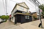 Corner Mixed use building. 2-stores plus 2-apartments and rear yard. Front store formerly bar and cafe.