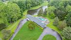 A Timeless Mid-Century Modern Estate in the Heart of Warwick, NY. Nestled on 15.5 picturesque acres in the charming town of Warwick, NY, this historic ranch home represents the pinnacle of mid-century modern design, a style that emphasizes clean lines, organic shapes, and a harmonious connection with nature. This is the â€œOGâ€ of its kind in this area, this property offers a rare opportunity to own a piece of architectural history, infused with elegance, versatility, and natural beauty.The residence itself is a stunning example of mid-century modern craftsmanship, featuring three spacious bedrooms and four bathrooms, including versatile service quarters that can be used as a mother-daughter suite or guest accommodations. The interior boasts imported Egyptian wool rugs, adding warmth and sophistication to its open, airy layout. A cozy fireplace provides a welcoming ambiance, perfect for relaxing evenings or intimate gatherings. The homeâ€™s design emphasizes simplicity and functionality, with organic shapes and natural materials creating a timeless aesthetic that appeals to those with a youthful eye for unique properties.Outside, the estate is a private sanctuary. The expansive land includes a beautiful in-ground pool, inviting residents and guests to unwind during warm summer days. The pond, with its charming dock, offers a tranquil retreat, the perfect setting for boating, fishing, or simply soaking in the serenity of nature. The propertyâ€™s lush landscape and mature trees create a sense of seclusion, making it an ideal retreat from the hustle and bustle of city life.The versatility of this estate is one of its most compelling features. It can serve as a luxurious primary residence for those seeking a private, historic home with modern amenities, or it can be transformed into an extraordinary retreat, perfect for group vacations, wellness retreats, or short-term rental opportunities. The spacious basement, finished at 700 square feet, provides ample recreational space for gatherings, fitness, or entertainment, enhancing its appeal as a destination property.Moreover, the land itself offers exciting possibilities. There is potential for subdivision, subject to local zoning regulations, which could allow the owner to develop additional homes or create a private enclave within this scenic setting. This flexibility adds a layer of investment potential, making it suitable for both personal use and future development.The town is famous for its apple orchards, farm markets, and outdoor activities, offering residents and visitors a quintessential Hudson Valley experience. The nearby Wineries and Distilleries, apple picking in the fall, and scenic hiking trails provide endless opportunities for leisure and exploration. The town also hosts annual festivals, farmers markets, and art shows, fostering a warm, welcoming atmosphere. For those who appreciate fine dining and boutique shopping, Warwickâ€™s charming downtown is filled with unique shops, cozy cafes, and gourmet restaurants.Living in Warwick means enjoying a harmonious lifestyle, where historic charm meets modern comfort, and natural splendor is just outside your door. Whether as a year-round residence, a weekend retreat, or a lucrative short-term rental, this estate offers limitless possibilities. Its unique style, extensive land, and proximity to a vibrant community make it a truly exceptional property, one that can be tailored to suit a variety of lifestyles and ambitions.This mid-century modern estate in Warwick, NY, is more than just a home; itâ€™s a lifestyle opportunity. It combines the elegance of historic design with the flexibility of modern use, set against the backdrop of one of the regionâ€™s most beautiful towns. Whether you seek a peaceful sanctuary, a social retreat, or an investment in a thriving community, this property delivers on all fronts, promising a life of beauty, privacy, and endless enjoyment.