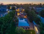 Waterfront paradise meets entertainerâ€™s dream at this rarely available gated compound in Biltmore Shores, offering 314 feet of property depth from curb to bulkhead, with a 20x40 saltwater in-ground pool, spa, patio, second-level deck, and private boat slips on a scenic canal just off Massapequa Cove. With 2, 855 square feet of living space, this two-level 4-bedroom, 3-bath stunner delivers flexible living for todayâ€™s lifestyleâ€”with room to expand to a 5th bedroom if desired.The heart of the home is the chefâ€™s eat-in kitchen, boasting custom wood cabinetry, a 12-ft granite island with bar sink, wine fridge, ice maker, and gas cooktopâ€”all open to a formal dining area and living space with vaulted ceilings and walls of French doors, letting in water views and sunlight throughout.Upstairs, two bedrooms with hardwood floors and two full bathrooms, one with spa steam shower. Downstairs, youâ€™ll find another primary bedroom with ensuite bath , walk in closet, and access to the lower-level patio, jacuzzi, lawn, and poolâ€”perfect for relaxing or entertaining. A second fireplace, laundry room, and two-car garage add convenience and comfort.Whether youâ€™re looking for year-round waterfront living in the Massapequa School District, a spectacular summer retreat, or an income-producing short-term rental, this home is ready. With multiple beach clubs nearby, Alhambra Park around the corner, and easy access to boating and waterfront dining, this is the lifestyle youâ€™ve been waiting for. Paradise found.