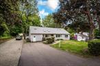 Great house for an extended family - 5 bedrooms. DETACHED BRAND NEW OVERSIZED 2 CAR GARAGE with Loft Above (in final stages of completion). Super convenient location, just a 2-minute drive to the Taconic State Parkway, Route 202 exit or take route 35 over to 684 for a more eastern easy commute. This home is serviced by town sewer and town water services. Hardwood flooring, cathedral ceiling in the main original living area. A significant addition to the kitchen features a large dining room and a family room that open up to a rear deck. The walk-out basement features a full bathroom and two rooms. The second floor features five bedrooms. SPECIAL FEATURES - CENTRAL AIR CONDITIONING, FURNACE, AND ROOF. A wide, extended driveway accommodates multiple cars. Convenient location for access to schools, shopping all major highways. Yorktown boasts a great community atmosphere, featuring numerous public parks and a beautiful bike trail that is also a popular walking trail. Town parks, pools, and a thriving community center! Showings by appointment only.