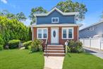 Welcome to 123 Mitchell Street in North Bellmore!This beautifully renovated home is located in a desirable and well-connected Long Island neighborhood. Move-in ready, the property features a new roof, new gutters, new flooring, and a modern kitchen equipped with Samsung appliances, including a built-in Sharp drawer microwave.The kitchen showcases an island, updated cabinetry, and elegant finishesâ€”highlighted by a decorative chandelier that enhances the spaceâ€™s warmth and appeal. A separate outside entrance to the upper level offers added convenience and flexibility, suitable for extended guests or multigenerational living (permit may be required for alternate use).The fully finished basement provides versatile additional living space with its own outside entrance, making it ideal for recreation, a home office, or storage. A dedicated utility/laundry area is also included. Conveniently located just 3 minutes from the LIRR, with easy access to Sunrise Highway and other major roads, commuting to New York City and nearby areas is simple. The home is close to Bellmoreâ€™s town center, with a variety of restaurants, shops, parks, and services that contribute to a welcoming suburban lifestyle. This home is within the Bellmore School District, offering access to well-regarded schools known for academic programs and extracurricular opportunities.