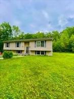 Gorgeous setting surrounds this well-positioned home located in the MINISINK SCHOOL DISTRICT. Enjoy over 7 acres on the Minisink/Greenville side of the mountain, only 3 plus miles to the RT 84, Mountain Rd exit for easy access. Generously-sized rooms capturing the rolling vistas of the front and side landscapes. There is ample finished space on the main floor with the opportunity to finish the lower level and add 600sf+. Full exterior deck spans the entire length of home, oversized 2 car garage with side door and room for workshop or hobbyist. French drains in rear of property, over 2+ acres cleared for enjoyment, pleasant and shaded outdoor sitting areas. Bring your fresh ideas and colors to this property. The dramatic setback and privacy captures the true essence of country living.