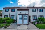 Welcome to your serene retreat in this charming top-floor, 1-bedroom, 1-bath, co-op! Nestled against a private wooded area, this well-maintained gem features newer windows inviting plenty of natural light, gas furnace, water heater and A/C all replaced in 2017. With its peaceful surrounding and abundant potential, this space is ready for your personal touch to make it your own. Enjoy use of the tennis court and pickleball court, clubhouse and in-ground pool. Landscaping, water, garbage/snow removal all maintained by the association.