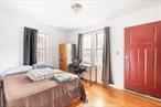 2 Family House with private driveway and garage. Move-in ready to one unit, and a great tenancy of 15+ years at market rate. Separately metered utilities, updated systems, fabulously well located in historic Jackson Heights. All photos uploaded are of the 1st-floor unit only.