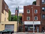Calling all investors: Do not miss this money-maker property. Property consists of one 2 bedroom, two 3-bedroom units, and a storefront. a must see.