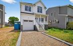 A newly constructed colonial waterfront residence is available in Baldwin Harbor. This spacious 2300 sq ft home features four bedrooms, two and a half bathrooms, central air conditioning, hardwood floors a 40 ft bulkhead with canal access, a gourmet kitchen with an island, a master suite with a bathroom, and additional three bedrooms.