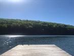 Private Lake House on a Private Lake!Little Whaley Lake, a serene 46-acre spring-fed, motor-free lake with only six homes offers unparalleled tranquility. This lot offers 150 feet of lake frontage and a private dock; ideal for peaceful swimming, fishing, kayaking, and reconnecting with nature. There are only 6 homes on this lake, with no public access, creating a quiet and peaceful environment. Bring your architect and your imagination. The 2-story cabin, built in 1906, retains its original character and needs either a re-fresh or use this chance to create your own dream country home. Located in Pawling, NY, just 70 miles from NYC, the property is easily accessible by car or via Metro-North station in town. Many great restaurants and shopping, close access to the Empire Rail Trail for biking. Showings by appointment only.