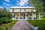 PRICE INCLUDES 2 BUILDING LOTS; CONVERTED CARRIAGE HOUSE; & BARN! ... Nestled on 17.9 ACRES, this one of a kind, CHARMING COUNTRY HOME was LOVINGLY BUILT FROM A CONVERTED CARRIAGE BARN ORIGINALLY BUILT IN 1860. Now 2, 400 sq. feet with 3 BEDROOMS & 3 BATHS, it was built within the original stone foundation with the hand hewn post and beams exposed to accent the ORIGINAL CHARM! BEAUTIFUL 10â€ PINE FLOORS, 9â€™ CEILINGS and many creative architectural details throughout. The first floor boasts a LARGE CUSTOM KITCHEN WITH A SUNNY SITTING/BREAKFAST ROOM, BEAUTIFUL GRANITE AND QUARTZ COUNTER TOPS, 5-BURNER GAS RANGE, STAINLESS STEEL BUILT-IN MICROWAVE, REFRIGERATOR AND DISHWASHER. SPACIOUS WALK-IN PANTRY! ..Enjoy the warmth and ambiance of the pellet stove. Adjacent to the kitchen is the sun filled dining room which overlooks the POOL and main barn. TWO SETS OF FRENCH DOORS LEAD INTO THE LIBRARY WITH COFFERED CEILING and WONDERFUL BUILT IN SHELVING. A powder room is conveniently situated next to the LARGE MUDROOM WITH ADDITIONAL BUILT IN STORAGE and the Laundry is also on the first floor. Two doors provide easy access to the POOL and COVERED OUTDOOR ENTERTAINING AREAS. Upstairs is the PRIMARY BEDROOM SUITE WITH CATHEDRAL CEILING & LOFT w/built in shelving, large walk-in closet and a beautiful ENSUITE BATH. TWO ADDITIONAL LARGE BEDROOMS, HOME OFFICE/YOGA ROOM/NURSERY and hallway SECOND FULL BATH complete the second floor. There is also a large finished attic. Looking past the wonderful and charming home, is the fantastic property, with wonderful old barns/outbuildings standing tall and proud since 1860! The large, open, main barn with stair access loft can be utilized for whatever interests you - ARTIST STUDIO, OFFICE, ULTIMATE PLAY SPACE - THERE IS EVEN AN INDOOR BASKETBALL COURT! Bring your HORSES and chickens and animals! Additional WORKSHOPS, TACK ROOM, 5+ STALLS, CHICKEN COOP, a heated mechanic&rsquo;s room and so much more are in the connected barns. THE WATER SUPPLY IS PLENTIFUL WITH A 90 GALLON/MINUTE ARTESIAN WELL PLUS A lovely SPRING-FED POND! A ONE BEDROOM CARETAKERâ€™S APARTMENT offering pristine views and an over-sized deck! .. Perfect for peace of mind property oversight and maintenance for your WEEKEND GETAWAY home! *** WOW! TWO BUILDING LOTS are included!*** BUILD A LUXURY 3, 500+ SQ. FT HOME WITH COMPLETE PRIVACY on the back of the 17+ acres and connect to the GATED LUXURY SUB-DIVISION on PRICES SWITCH ROAD! This approved building lot offers nearly complete forever-privacy surrounded by NJ State Parklands and a large farm with PDR status!  Minimum lot size is 4 acres but can be more! Build for yourself or potentially sub-divide! A SECOND BUILDING SITE is also possible overlooking the private pond! Don&rsquo;t miss this QUINTESSENTIAL WARWICK property and all that it offers....COUNTRY FARMHOUSE LIVING AT ITS BEST! Meander down your own wooded, mature tree lined lane to the SPRING FED POND, LEAN-TO, RIDING TRAILS & BREATHTAKING ROLLING FIELDS which BUTT NJ PARK AND WILDLIFE PRESERVED LAND - less than 2% of this property has wetlands.  Visit the many vibrant wineries, breweries, restaurants, orchards & shops Warwick and the surrounding area has to offer. ..... Close to NYC with convenient transportation options for commuters. ...Warwick Valley schools, a strong community, unparalleled scenic landscape and so much more make 88 Prices Switch Road in Warwick, NY THE PERFECT PLACE FOR YOUR YEAR-ROUND OR WEEKEND HOME. ***THIS 17.9 ACRE PROPERTY INCLUDES FUTURE SUB-DIVISION OPPORTUNITY TO BUILD A SECOND HOME WITH A DRIVEWAY ENTRANCE FROM PAIGEâ€™S WAY, A LUXURY SUB-DIVISION WITH A PRIVATE, GATED ROAD PLUS a POSSIBLE SECOND POND-VIEW BUILDING SITE AS WELL!***