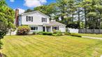 Nestled on a sprawling, elevated property in the desirable Tanglewood Hills section of Coram, Long Island, this classic colonial home offers both elegance and modern comfort. Boasting 3 well-appointed bedrooms, including a serene master bedroom with a private ensuite bathroom, and an additional 1.5 baths, this residence has been thoughtfully updated. The kitchen shines with exquisite granite countertops, while bathrooms have been recently renovated for contemporary appeal. Gather around the charming fireplace on cooler evenings or enjoy a refreshing dip in the private pool during warmer months. A convenient 1-car garage and extensive grounds provide ample space and much needed privacy to share with family and friends.* OFFERING SELLER&rsquo;S CONCESSION RATE BUY DOWN