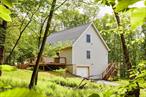 Atop a wooded hillside, on a peaceful country road just fifteen minutes from Livingston Manorâ€™s bustling Main Street, sits this charming Catskills cottage. Clean, modern design, high ceilings and loads of natural light are just a few of the highlights here. Coming from the long private driveway and in through the convenient one car garage, your daily entry will take you in through the finished portion of the basement, most recently used as a studio space. A polished concrete floor and great lighting make an excellent canvas for your future visions. Up on the ground floor, youâ€™ll enter in the airy main living space, with cathedral ceilings. The seating area flows nicely into a large dining space and incredibly charming kitchen, with terrazzo-styled tiling, stainless steel appliances, and sliding door on the deck with a lovely view of the back yard. A convenient and spacious first-floor bedroom and full, tiled bathroom with walk-in shower complete this level. The second floor is entirely occupied by the primary suite. The large bedroom features a convenient dressing area and is complemented by a beautiful tiled bath with soaking tub. Outside youâ€™ll find a spacious deck for outdoor dining and entertaining, and a very Catskills-appropriate firepit. The grounds behind the house are gently sloping and offer plenty of space for gardens and/or wildlife watching. The surrounding forest offers a sense of privacy and provides a calming susurrus on breezy days. In ten minutes or less, you can be at public fishing access on the famous Willowemoc River, or if land pursuits are more your style, at some of our favorite trailheads in the Willowemoc Wild Forest: Hodge Pond and Frick Pond. A few minutes further and youâ€™ll find all the attractions of Livingston Manor, including Threshold, Upstream Wine, The Walk-In, Spruce Home Goods and much more!