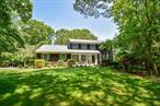 Elegant Clarendon Center Hall Colonial Nestled on a serene cul-de-sac in the prestigious Soundview Acres, this home offers the perfect blend of classic charm and modern comfort. Set on .92 acres of private, landscaped grounds, this home boasts deeded beach rights and access to a lifestyle of tranquility and convenience.Step inside to discover a warm, inviting interior with gleaming hardwood floors throughout, recessed lighting, and Andersen windows that fill the home with natural light. The heart of the home is the eat-in kitchen, beautifully updated with quartz countertops, stainless steel appliances, and ample cabinetry. This spacious residence features 4 generous bedrooms and 2.5 well-appointed baths, including a primary suite offering privacy and comfort. Enjoy both formal and casual living spaces with a formal living room, elegant dining room, and a cozy family room complete with a wood-burning stove. Unwind in the enclosed screened-in porch overlooking a seasoned garden, or retreat to the full finished walk-out basement featuring rich cedar walls, lending a warm, rustic charm, a home theater, and a gym/yoga areaâ€”ideal for entertainment and wellness. Step outside to your private backyard oasis complete with an in-ground heated pool, perfect for summer gatherings and peaceful evenings. A covered front porch adds to the homeâ€™s welcoming curb appeal. Additional highlights include a new burner installed in 2025, ensuring energy-efficient comfort year-round. This is a rare opportunity to own a meticulously maintained home in a highly sought-after location known for its privacy, community charm, and proximity to Long Island Sound. Close to shopping, restaurants, wineries, farm stands. Private Beach enjoy endless sunsets, fishing, kayaking, paddleboarding, or simply a peaceful day at the beach.