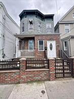 This well-maintained two-family home, situated on a 25.17 x 100 lot in R5B zoning, offers versatility and convenience in the heart of Corona. The first-floor unit features two spacious bedrooms, a bright living room, a full bathroom, and a large eat-in kitchen, ideal for comfortable family living. The second-floor unit is a charming one-bedroom residence with a living room, kitchen, full bathroom, and a beautiful skylight that fills the space with natural light. A full finished basement with a separate entrance provides additional living or recreational space. Enjoy a generous backyard, perfect for outdoor gatherings, along with a private 2-car driveway and 1-car garage. Conveniently located near shops, restaurants, parks, schools, and just steps from the Q72 bus, this property offers both investment potential and comfortable multi-generational living.