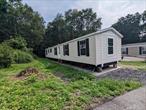 Brand new manufactured home in desirable Forest Park, with low lot rent at $705 per month. This beautiful 3-bedroom, 2-bath residence blends modern contemporary style with everyday functionalityâ€”perfectly situated in a fantastic commuter-friendly location. With nearly 1, 000 sq ft of bright and airy living space, this home is designed for comfort, convenience, and style. Wide-open floor plan that effortlessly connects the spacious living room, dining area, and large kitchenâ€”ideal for entertaining or simply enjoying a cozy night in. Kitchen features beautiful shaker-style cabinets, a double stainless steel sink, and sleek appliances.  High ceilings and recessed lighting throughout the home enhance its open, airy feel. The primary bedroom is a peaceful retreat, complete with a full en suite bathroom. Two additional bedrooms and a full guest bath are located at the opposite end of the home, offering both space and privacy for family or guests. Enjoy outdoor living on your private side deckâ€”a great spot for relaxing, grilling, or entertaining. 10 minutes to Newburgh 84/87 and 70 Miles to NYC. Near West Point, Stewart Airport, Beacon Bridge, Ferry, Metro North, 17, 84 and 87. Call now this one will not last. $705 Monthly Lot rent fee.