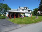 The Famous Woodstock Watering Hole located on Dr. Duggen Road, Bethel, NY, is only a few miles from the original site of Woodstock and is now for sale. Family owned since 1949, the present third generation owner says it is time to retire. The only watering hole for miles around includes an inside dinning room with a commercial kitchen and a small outside kitchen used in connection with the outdoor covered pavilion, beautifully built by talented Amish carpenters. The owners use their property for things like Open Mic, Band Performances, Car Shows and Holiday Bazaars. There is also an outdoor fire pit. Two one bedroom apartments round out the upstairs that could be rented out for additional income or if reconfigured would be an excellent apartment for the new owner, operator. Lots of paved parking and a extensive loyal customer base.  Close to public motor boat lakes, White Lake and Lake Huntington. Only several miles from Lake Superior Park & Beach. The Bethel Woods Performing Art Center is also only several miles away. Located only a few hundred feet from Route 17B, the main artery to Bethel and two hours from NYC.