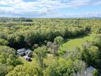 The Nature Enthusiast&rsquo;s and Sportsmanâ€™s Paradise on 88 acres with Endless Potential. Discover the perfect blend of privacy, nature, and outdoor recreation with this 88-acre retreat, ideal for hunters, homesteaders, and nature lovers. Tucked deep in the countryside, this property offers a classic old hunting camp, surrounded by a diverse landscape teeming with wildlife and potential. This 1900s house offers a solid basecamp for weekend getaways, hunting trips, or renovation into a cozy off-grid hideaway. For those looking to build their dream home, several potential building sites across the property offer beautiful views, open fields, and total seclusion. The land itself is a true outdoorsmanâ€™s dream â€” featuring a spring-fed pond, a year-round stream, mature fruit trees, and historic stone walls. Trails meander throughout the property, perfect for ATVs, side-by-sides, horseback riding, or hiking. Wildlife is abundant, with frequent sightings of deer, turkey, and other game species, making this a prime hunting location. A 2-bay garage, provides ample room to store gear, equipment, and recreational vehicles, and includes an unfinished upper level with potential for added storage or a future bunkroom. Whether you&rsquo;re looking for a private hunting haven, a weekend getaway, or the site of a future homestead, this one-of-a-kind property offers unmatched natural beauty, privacy, and opportunity.