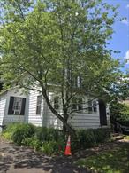 Price adjustment...Rare opportunity this legal two family, 3 bedroom 1 bath washe/dryer hook up on first level with enclosed front porch and fireplace in living room. The 2 bedroom 1 bath on second level has washer/dryer and sitting porch .. Front porch interior foyer entrance to both apartments and unfinished basement Both apartments have exterior stairs also Two car detached garage in rear of property. Large level side yard. This property is zoned Commercial Shopping ( C/S Zone }. Many possibilities for this very unique property for sure. Lots of potential .Steps from the middle of town and New Jersey border. South Orangetown school district location, Location, Location
