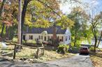 Come home and feel like you are on vacation. Perched above Shore Drive, this ideally located home has year-round water views while still being in close proximity to the shopping, dining, and groceries on Route 6. Easy commuting with its close proximity to the Taconic State Parkway. Whether you are cooking, gathering around the table, working in your home office, or relaxing at the end of the day, you can enjoy water views from almost any room! Cozy living room with wood-burning fireplace. Private and level backyard. Dine outside on the enclosed porch. This home is registered with the 100% Money Back Guarantee Program
