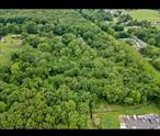 Nestled in a quiet and wooded setting, this raw, vacant parcel offers approximately 2.76 acres of prime rural-residential land. Surrounded by mature trees and natural beauty, the property provides privacy while still being conveniently located near local amenities and main roads. Featuring easy access via a 20â€™ wide lane and bordered by the NYC aqueduct line, itâ€™s an ideal opportunity for building a private residence, retreat, or investment property. Survey available.