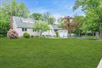 Large Expanded Colonial Cape with Room to Modify for Extended Family/Two Zones of Trane Central Air ( 10 years young)/Expanded Circular Driveway/Andersen Windows/ Smithtown Schools/ Large 2.5 Car Deep Garage/Granite Eat In Kitchen/ First Floor Laundry with Sink/Hardwood Floors /Good For Professional home office or a mother/daughter apartment with 8 car parking