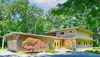 Welcome to your dream retreat in Fiddlers Green (dues), one of the most sought-after waterfront communities on Lloyd Neck. This post modern 4 bed 3 1/2 bath home features an open concept floor plan with clean architectural lines, expansive windows and pristine hardwood floors throughout. The living room features a stone fireplace and flows seamlessly into a state-of-the-art kitchen equipped with stainless steel Bosch appliances and an expansive quartz counter-top island. A walk-in pantry and formal dining room make this home an entertainerâ€™s delight! 3 bedrooms & 2 1/2 baths complete the first floor. The second floor offers a large family room and primary bedroom with ensuite, walk in closet and sliders to a screened in roof top porch! Outdoor living is elevated with a large Trex deck and a sunshade overlooking the flat 2 acres. Deeded rights to both Fiddlers Green Beach and Lloyd Harbor Village Beach, homeowners have access to mooring rights, summer camp (fee), tennis, playground and pavilion. If you are looking for a perfect balance of style & comfort with a strong connection to nature, welcome home! *Several Home And Property Improvements Within The Last 12 Months. Tennis Court As Is.