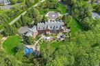 Welcome to the epitome of luxury living at 10 Orchard Lane, nestled in the prestigious enclave of Old Westbury, NY. This magnificent residence epitomizes timeless elegance and sophistication. Spanning approximately 10, 085 square feet, this stately brick home features 6 bathrooms and 6/7 oversized bedrooms, 4 are ensuite, ensuring both convenience and privacy for residents and guests. Situated on a sprawling 4-acre lot at the end of a cul-de-sac, the property offers unparalleled tranquility and space for outdoor relaxation and entertainment. Step into luxury to discover the meticulous attention to detail, you discover the thoughtful details throughout the home from the custom millwork to the radiant heated floors that gracefully extend throughout the entire residence, ensuring comfort and warmth. In addition to an elevator that provides seamless access to all levels, adding a touch of convenience and accessibility. Five fireplaces add warmth and ambiance to the living spaces, creating an inviting atmosphere for gatherings. The primary bedroom boasts two balconies, oversized closets, and a dressing room that could easily double as a seventh bedroom, offering flexibility and luxury. The outdoor oasis is equally impressive, featuring a built-in Gunite saltwater pool with a cascading waterfall, surrounded by meticulously landscaped grounds and a blue slate patio. A three-car heated attached garage provides convenience year-round, while the full walk out unfinished basement approximately 4000 sq ft and approximately 11-14 foot ceilings offers endless possibilities for customization, including space for a golf simulator or additional living areas. Jericho School District. Rarely does a property of this caliber become available. Don&rsquo;t miss the opportunity to make 10 Orchard Lane your own. Schedule a private showing today and experience the allure of this distinguished estate firsthand. Welcome home to unparalleled luxury and timeless sophistication. Dressing Room can be converted to a 7th bedroom if needed.