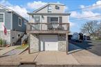 Located in the Bay Park section of East Rockaway, this elevated 3-bedroom, 2-full-bath home offers both style and peace of mind with FEMA-compliant construction. The front foundation showcases a beautiful stone facade, while the sides and rear are finished in clean, modern stucco.Inside, youâ€™ll find a bright, sun-filled layout with a spacious kitchen and open living areaâ€”ideal for both everyday living and entertaining. All three bedrooms are situated on the top floor, providing a comfortable and private retreat. The generous rear yard offers endless potential for outdoor living, gardening, play and direct waterfront access. This move-in-ready home combines functionality, curb appeal, and future flexibilityâ€”all in a welcoming neighborhood close to parks, water access, and transportation.