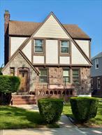 Spacious Tudor Style Home on Wide lined Street in Cambria Heights!! Home has amazing room size of a traditional Tudor, Living Room features Fireplace, Formal Dining Room, bedrooms are amazing size-- Main bedroom can be king size plus set, second bedroom can be queen size set and third bedroom can accomodate a full size set.  Step outside to Private Driveway, One Car Garage and a large backyard to Enjoy!! Conveniently located -- close to main road, transportation, shopping etc.  Home will not last