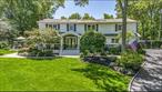 Welcome to this stately 3, 800 sq ft Colonial nestled on a shy one-acre lot in the heart of Hauppauge. Graced with a charming front porch and surrounded by mature trees and lush gardens, this home offers both privacy and scenic views of nature in every season. Step inside to a tiled entryway that leads to the kitchen featuring rich oak cabinetry, gleaming granite countertops, tiled backsplash, new fridge and range, and a separate breakfast area perfect for casual dining. Entertain effortlessly in the formal dining room, complete with custom built-in cabinetry, or host gatherings in the elegant living room, highlighted by a distinctive tray ceiling with accent lighting, gas fireplace and wet bar. Crown molding, recessed lighting and oak flooring throughout the home. With four oversized bedrooms and three beautifully renovated bathrooms, this home provides exceptional space and comfort for all who wish to call it home. The luxurious primary suite features a spa-inspired bath with a seated shower and custom finishes, The finished basement offers additional space which includes a dry bar. and drink fridge, and lots of storage. On the other side of the house is a legal accessory apartment with a kitchen, den w/gas fireplace, two more bedrooms and a full bath.  Outdoors, enjoy a private oasis with a beautifully designed 20 X 40 new heated in-ground pool with an automatic pool cover. A tranquil new paved patio area, and vibrant gardens, and outdoor shower. Trex deck off kitchen great for grilling. A she-shed insulated and tastefully done, with a fenced in vegetable garden. Central AC with two units, inground sprinklers, solar with 51 panels fully owned, 200 Amp electrical service, two legal sheds, an open garage (roof over), fenced yard, huge driveway with plenty of parking. This property is surrounded by quiet, private unbuildable town owned neighboring lots on a cul-de-sac. Donâ€™t miss your opportunity to own a truly remarkable home that blends timeless charm with modern amenities in a peaceful, sought-after area of Hauppauge!