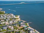 Bayfront home perfectly positioned on the Great South Bay, offering a rare and coveted lifestyleâ€”where only a limited number of residences sit directly on the open bay. Nestled on a quiet cul-de-sac, this property boasts panoramic water views, 130 feet of bulkhead, and a resort-like setting complete with a heated pool and expansive outdoor space that truly captures the essence of waterfront living. This beautifully appointed home features 3 bedrooms, 3.5 bathrooms, Eat-in-kitchen, a 2-car garage, central air conditioning, and a spacious primary en-suite with breathtaking views. Additional highlights include hardwood floors throughout, a cozy den, and two fireplacesâ€”all situated on a generous 0.40-acre lot. As a resident, you&rsquo;ll also enjoy access to exclusive Willetts Point Private Beach Club, offering a range of amenities and a true sense of community and coastal living for its members.