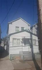property in the heart of south ozone park, garage, bedrooms, living room, needs tlc do not disturb occupants