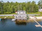 Welcome home to the lake. Outstanding panoramic lakefront views from everywhere in this White lake/Kauneonga Lake contemporary home. Set right on the water featuring a year round dock multiple sun decks overlooking the water and its own shady sand beach below. The home features hardwood flooring in the main living area which is an open concept allowing you to enjoy the lake from every room. French doors from the living room allow for access to the main deck area, another set off of the dining area lead to a screened in porch overlooking the water. Full bathroom along with laundry connections on main level. Central stairs lead to both additional finished levels both with walkout access to the lake. Upstairs features large main bedroom with breathtaking views of the lake. There is a door that leads out to a private second level sun deck overlooking the water, with a set of stairs that lead down to main deck area. Main bedroom does have a mini split central a/c unit. Lower level is finished with a second bedroom which does have a propane stove for additional heating as well as electric baseboard, along with second full bathroom, there is an additional room approx 350 sqft that is used as gym with a sauna/ that overlooks the water and below the decking. Can be made into a 3rd bedroom or sleeping are if need, as it has a door to outside for lake access. The exterior features gardens to the left along with blue stone patio in the shade. White lake offers multiple restaurants accessible via boat, as well as being able to walk from this home, along with being one of the more social motor boat lakes in the area. The home does features municipal sewer and has it own water source with a drilled well.