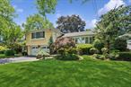 Welcome To This Beautiful Split-Level Home, Where Contemporary Style Meets Timeless Charm. One Of The Rare Hewlett Properties Located Within The Sought-After Lynbrook School District, This Home Offers Both Elegance And Convenience. Step Into A Warm And Inviting Entry Hall That Leads To A Charming Eat-In Kitchenâ€”Perfect For Everyday Meals. Just Off The Kitchen, An Elegant Formal Dining Room Features Sliding Doors That Open To A Spacious Deck, Ideal For Entertaining Guests Or Enjoying Outdoor Dining. The Graciously Sized Living Room Is Anchored By A Classic Bay Window And A Cozy Wood-Burning Fireplace, Creating The Perfect Setting For Relaxing Or Hosting. Ceiling Speakers In The Primary Bedroom, Living Room, Dining Room And Outside Provide For Your Musical Enjoyment. Upstairs, Youâ€™ll Find Not One, But Two Spacious Primary Bedrooms, Each With Its Own En Suite Bath, Offering Comfort And Privacy. A Third Bedroom Adds Even More Flexibility For Family Or Guests. The Lower Level Offers A Large, Comfortable Family Room, A Stylish Half Bath For Guests, And Convenient Access To The Backyardâ€”Great For Gatherings And Play. Additional Features Include Direct Garage Entry Into The Home, Plus Bonus Rooms Ideal For A Home Office, Guest Quarters, Or Extra Storage. This Home Truly Has It Allâ€”Space, Style, And Location.